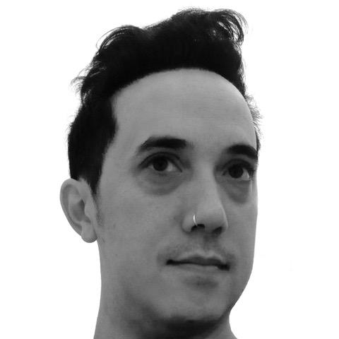 A black and white closeup of a young male (Alex Lum) with short black hair and a nose ring
