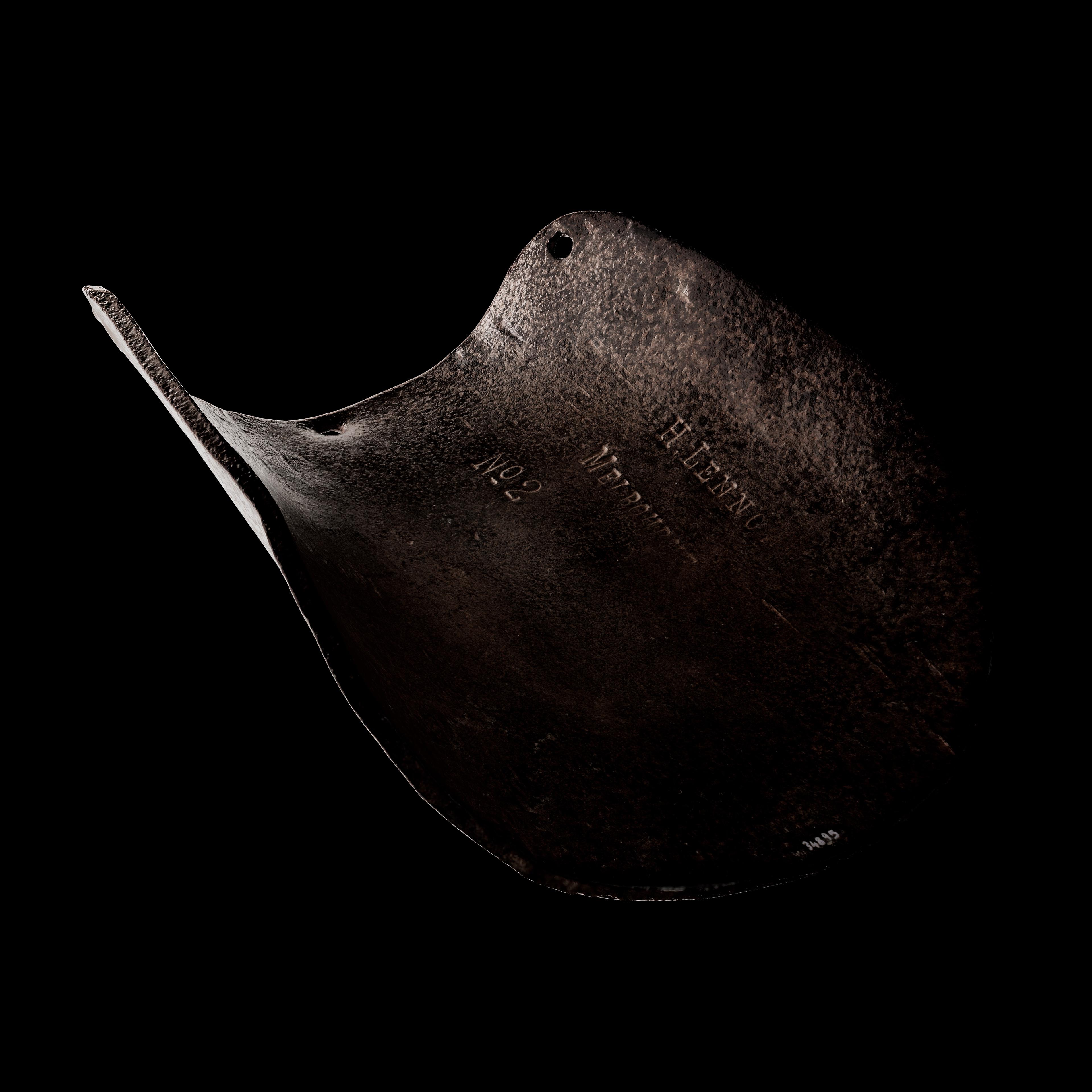 Digital render of a piece of armour at an angle. The light relief shows text engraved on the armour plate.
